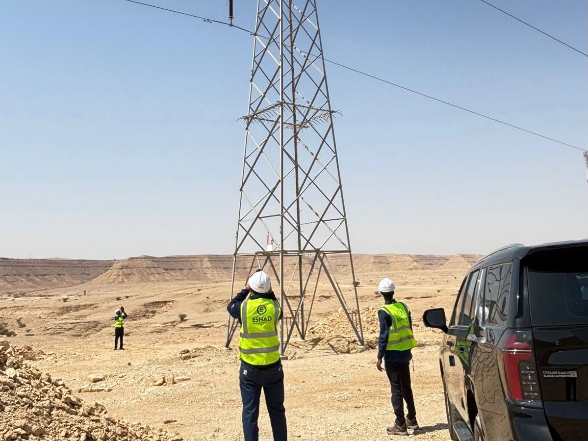 ESNAD engineer inspecting a transmission tower foundation