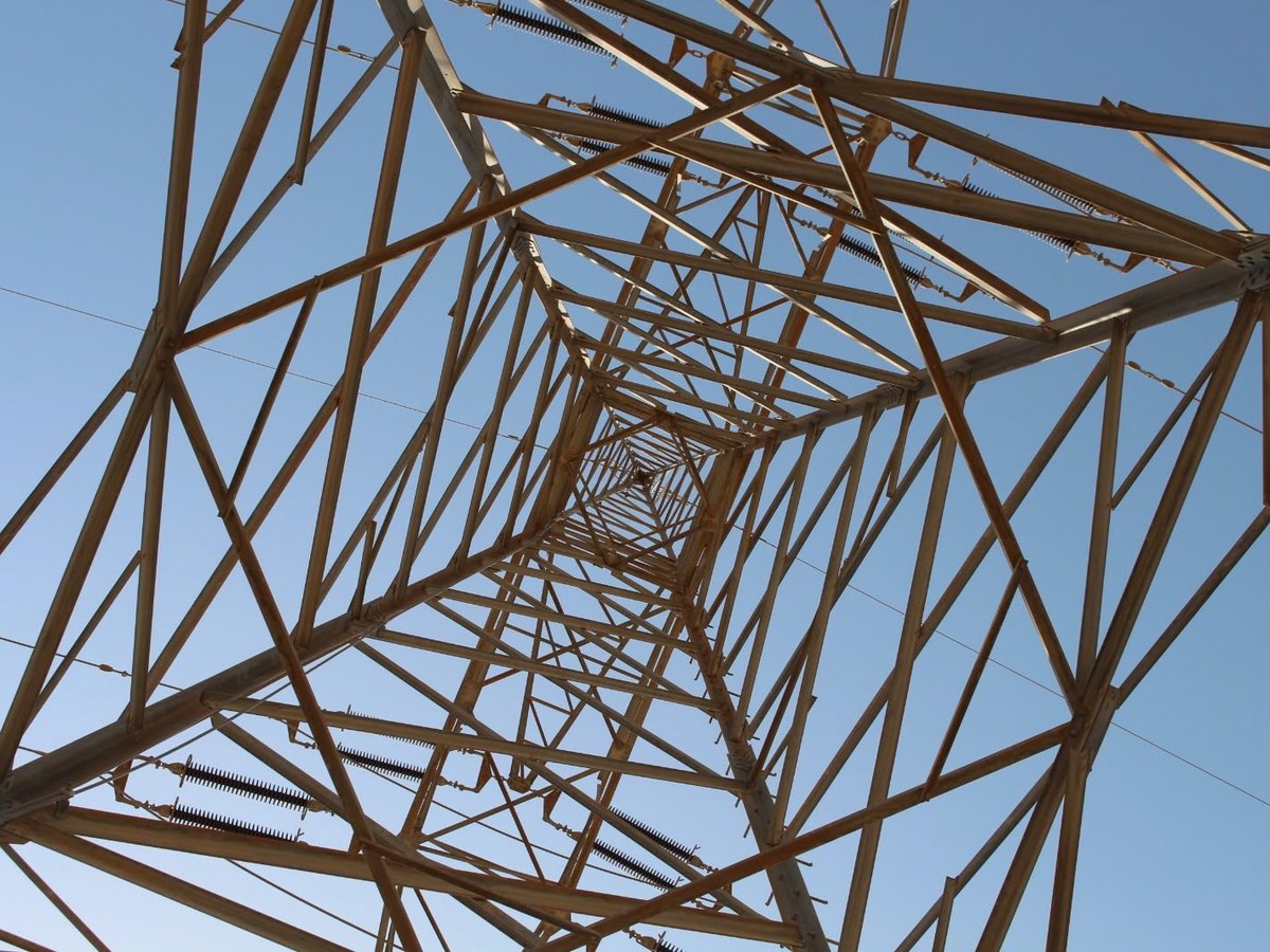 ESNAD engineer inspecting a transmission tower foundation
